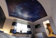 Bedroom with printed ceiling